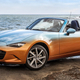 Illustration for article titled Placate Your Fears Of Global Economic Collapse With This Two-Tone Miata With A Denim Interior